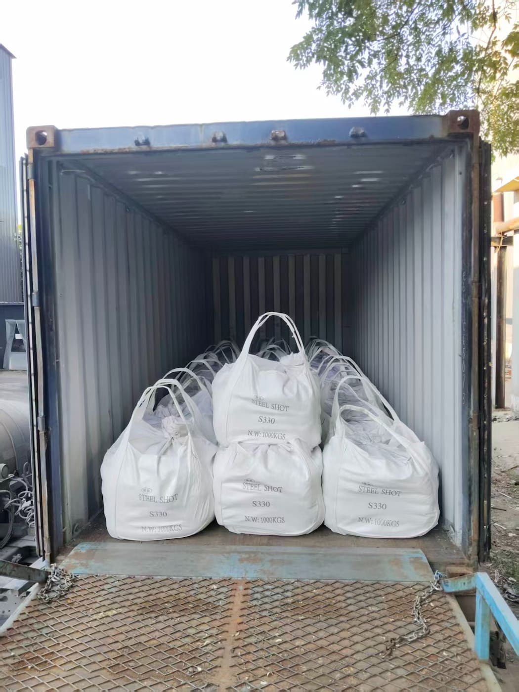 S330 steel shot bulk bags arranged inside a shipping container S330 steel shot bulk bags arranged inside a shipping container