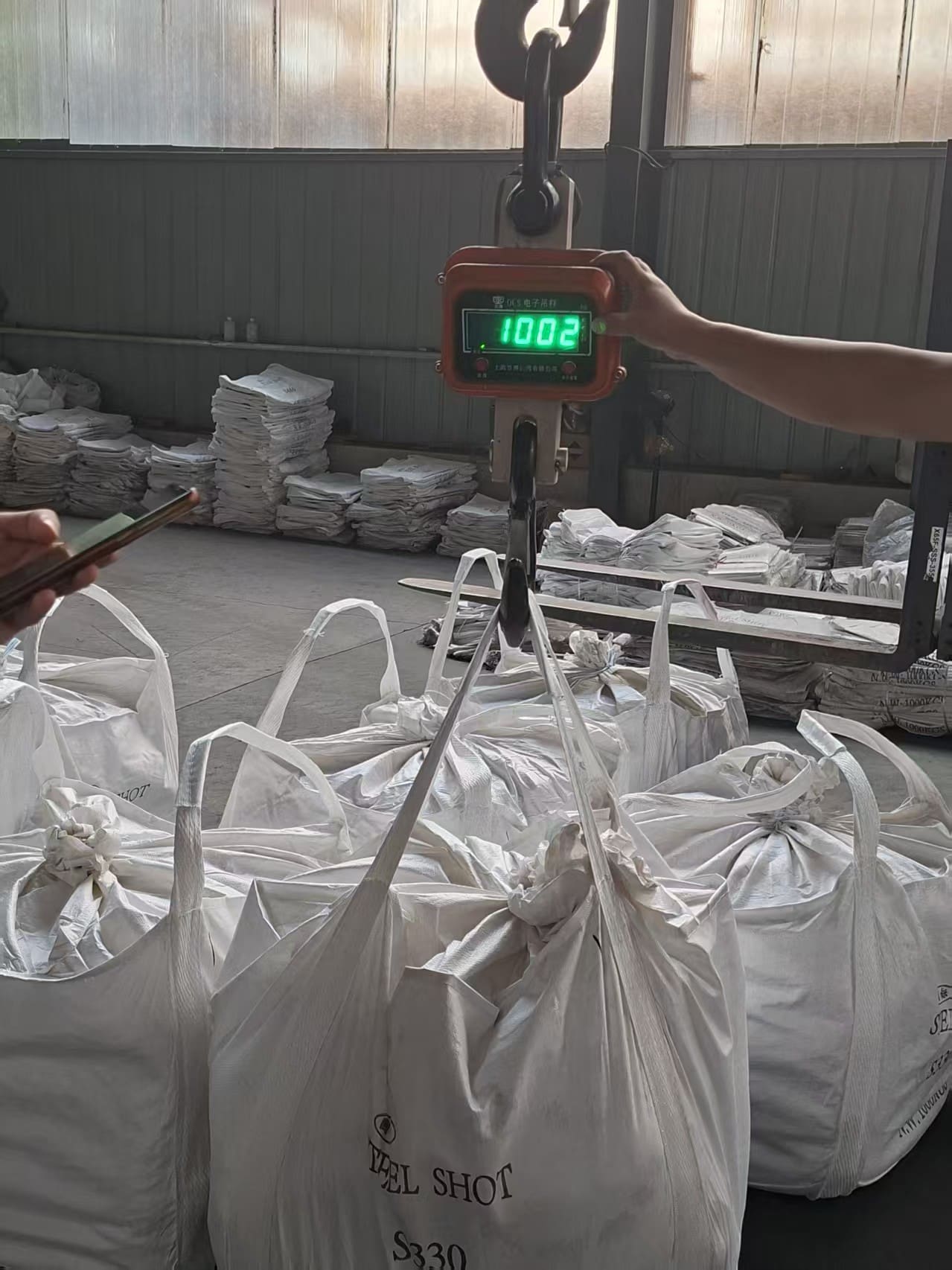 S330 steel shot bulk bag being weighed on a digital crane scale S330 steel shot bulk bag being weighed on a digital crane scale