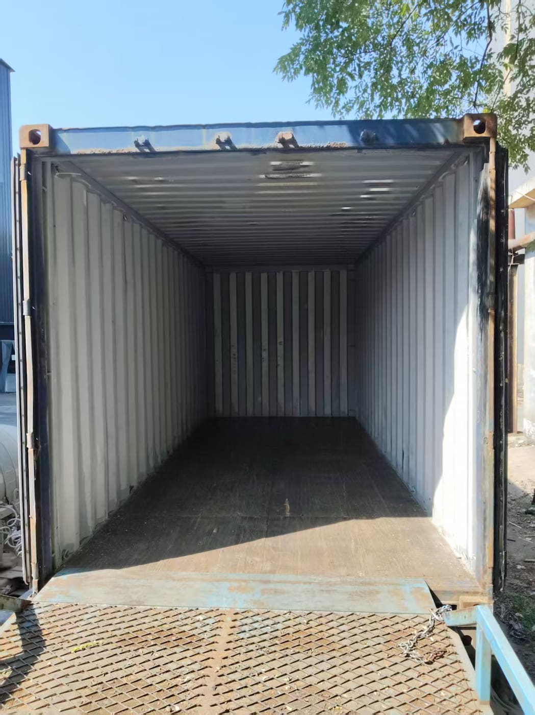 Empty shipping container interior before loading steel abrasives Empty shipping container interior before loading steel abrasives