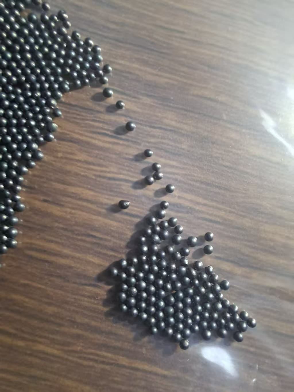 Round cast steel shot particles