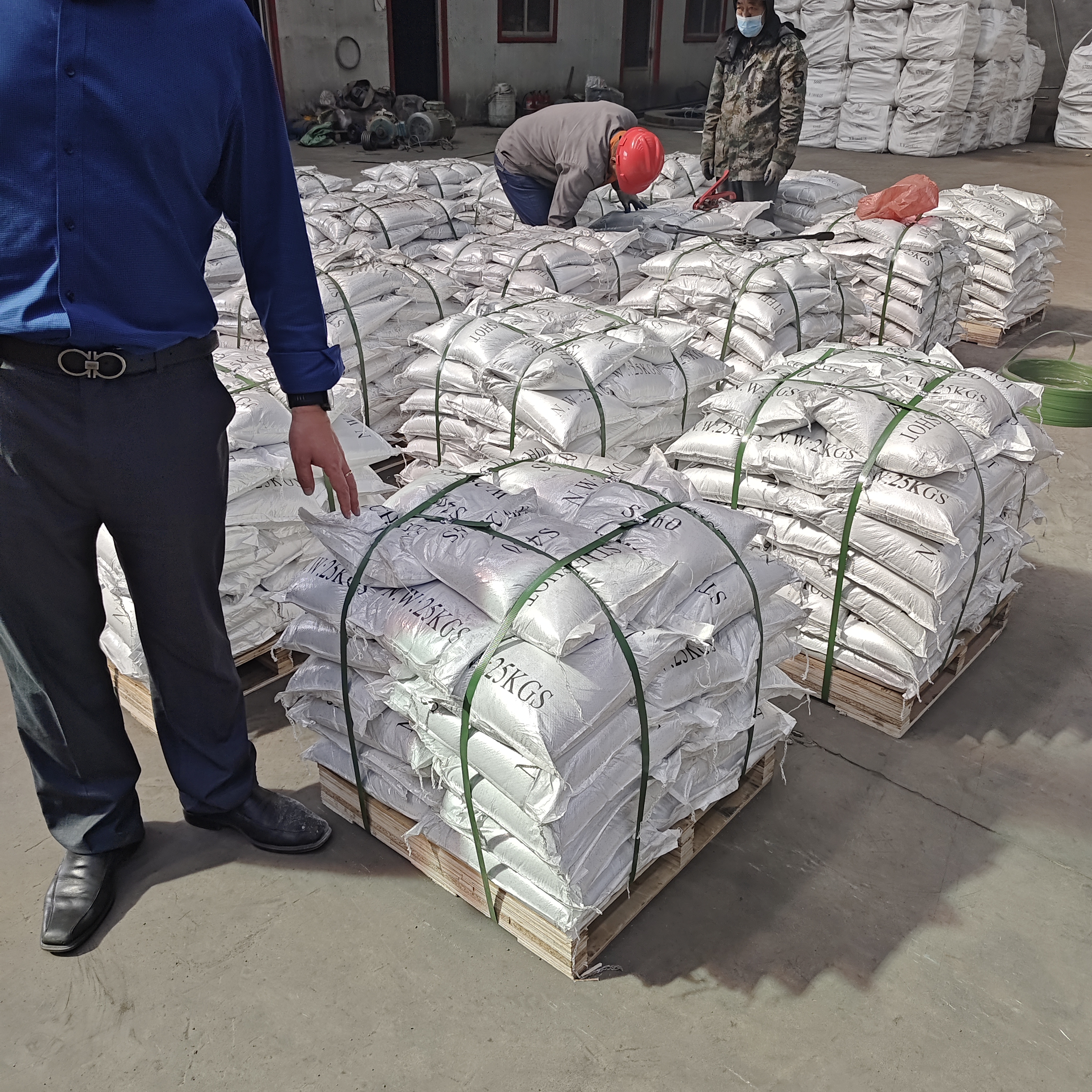 Steel abrasive 25 kg bags stacked on pallet for export delivery