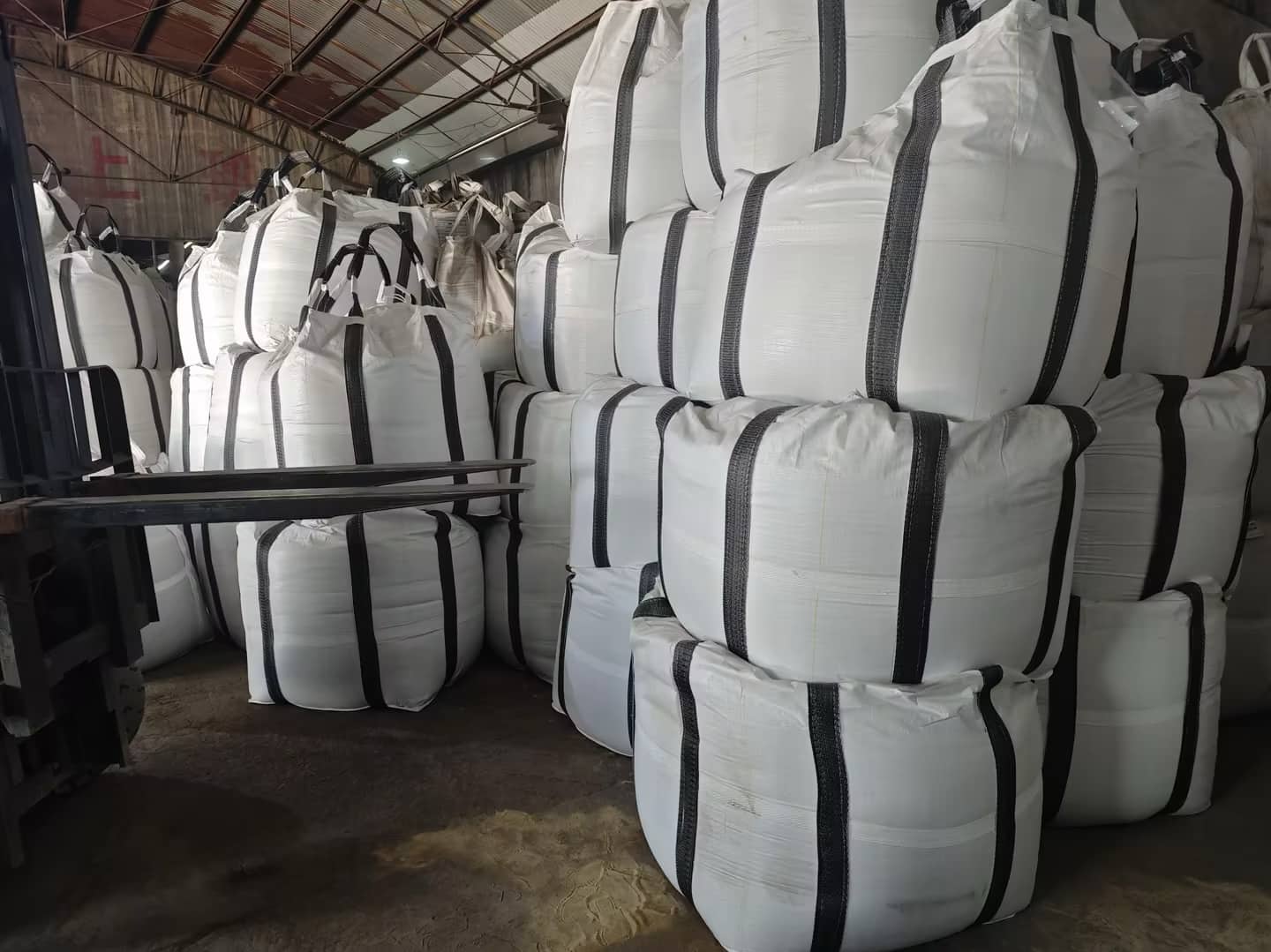 Forklift access to ceramic proppant bags lower in the warehouse stack