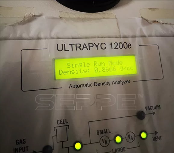 Cenosphere sample in an automatic gas displacement density analyzer