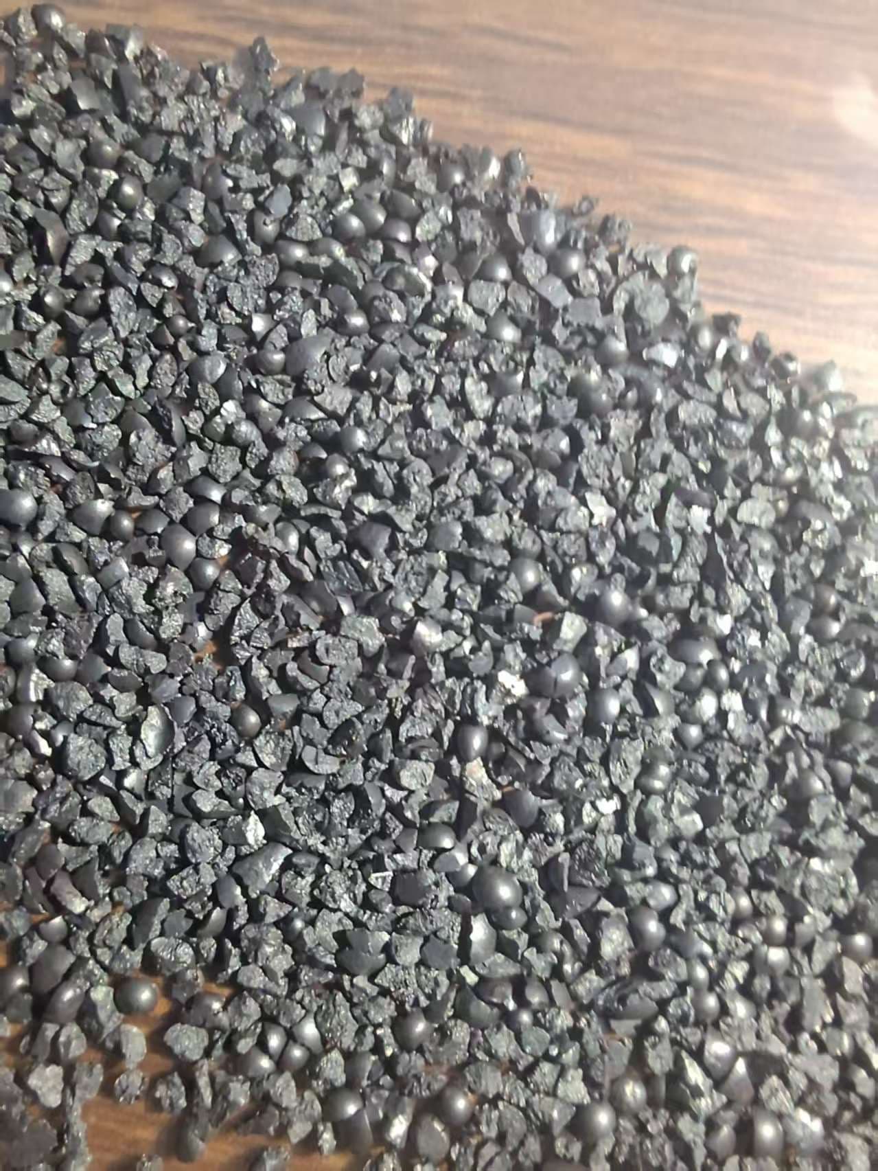 Angular cast steel grit particles
